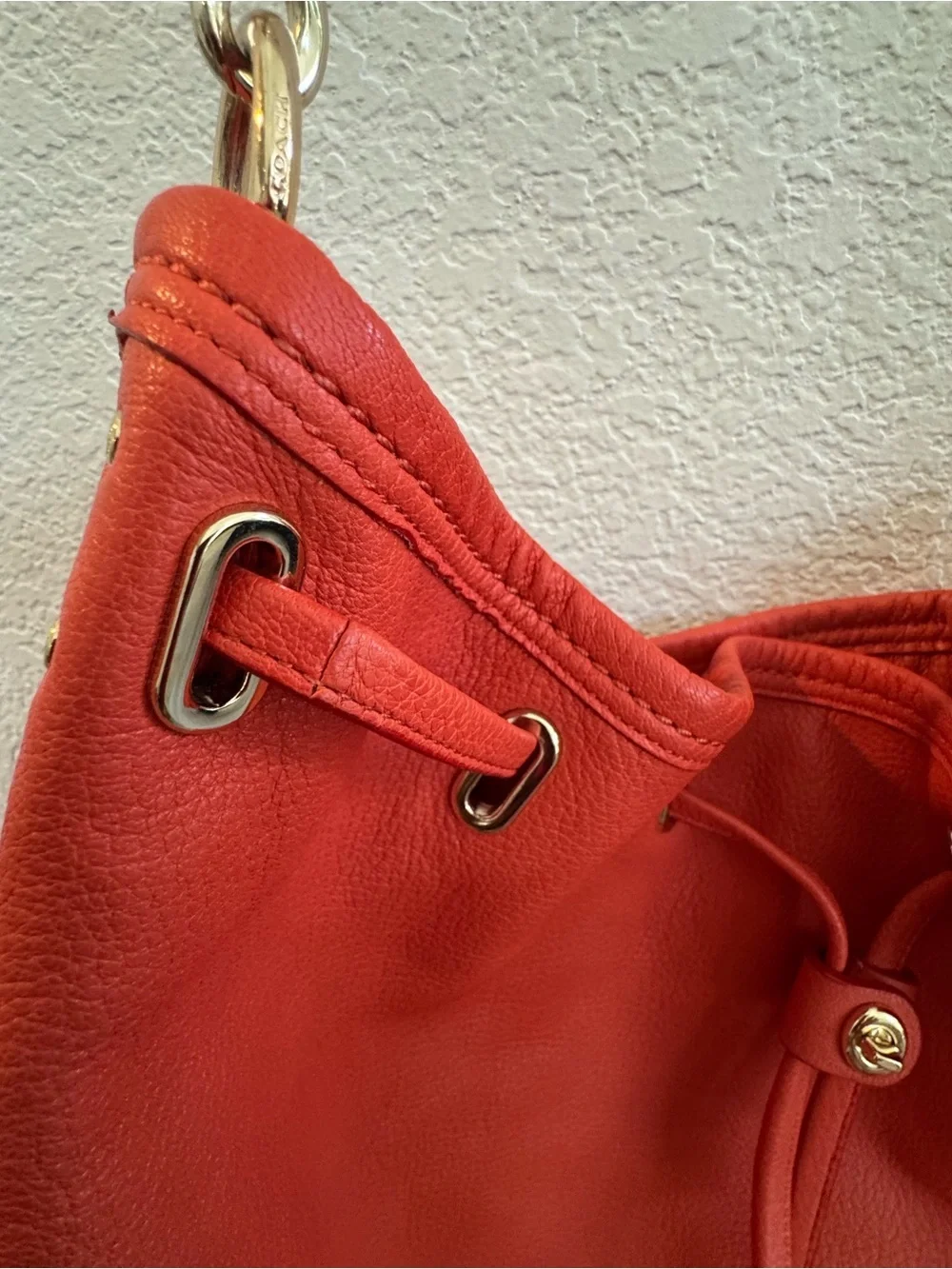 Coach Twist Lock Coral-Orange Pebbled Leather Drawstring Shoulder Bag